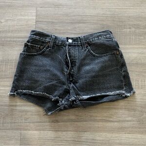 Levi’s 501 distressed black denim shorts